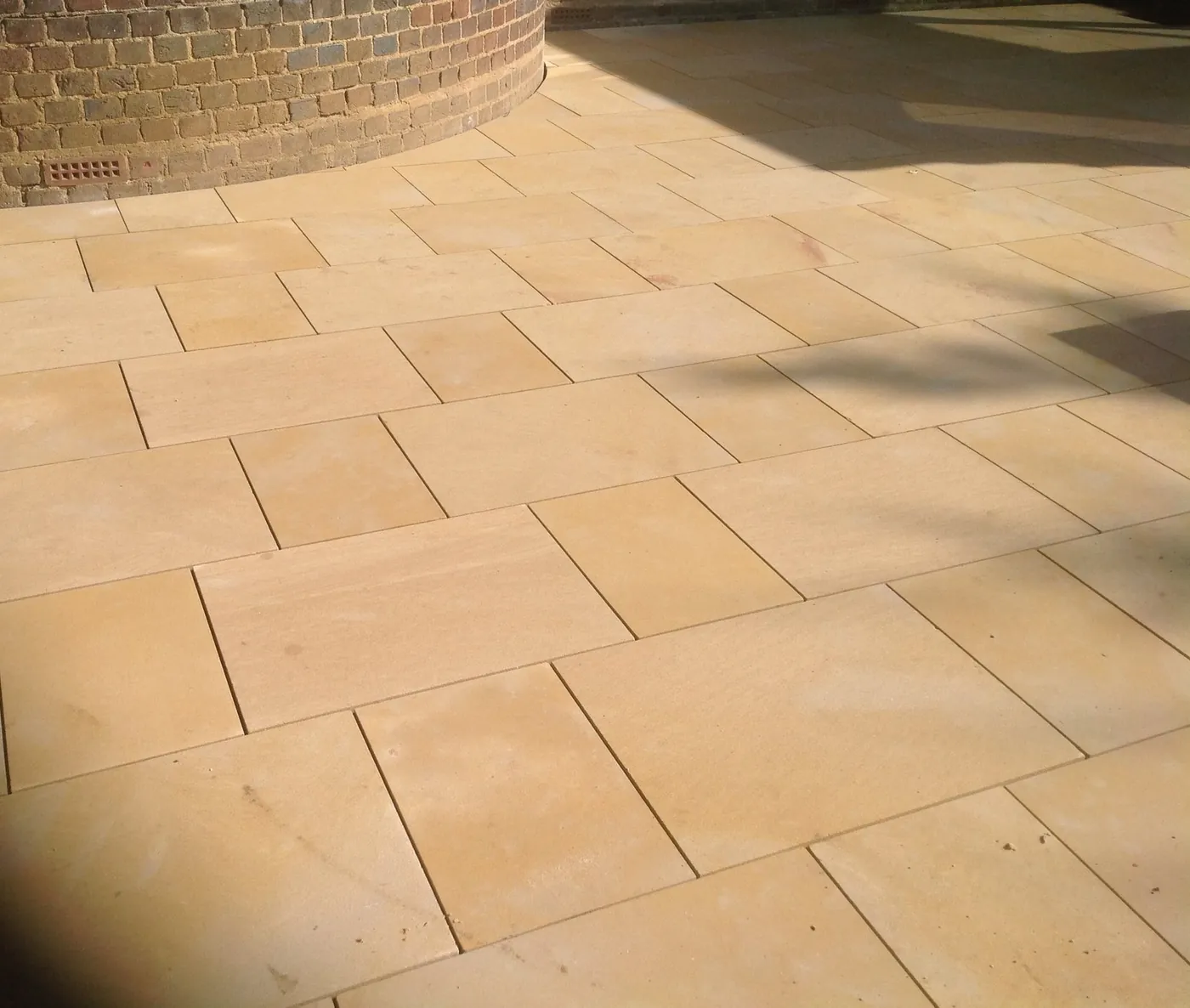 Sandstone paving in warm tones