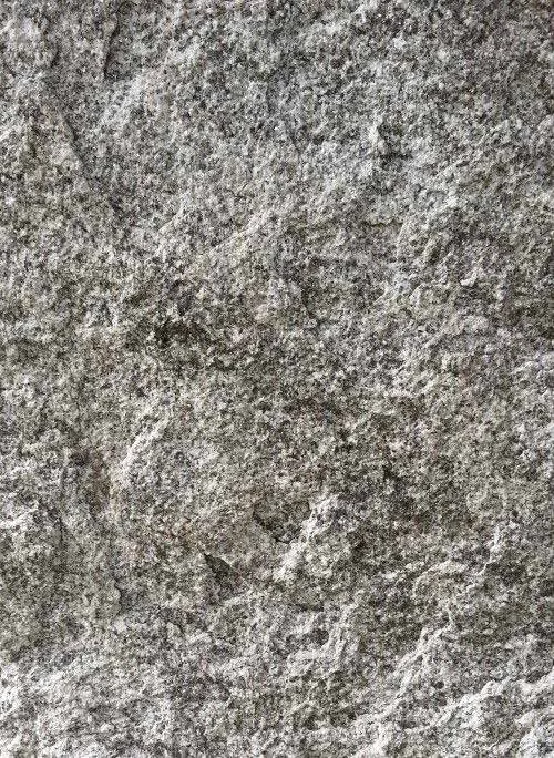 Rough texture of grey Iberian granite