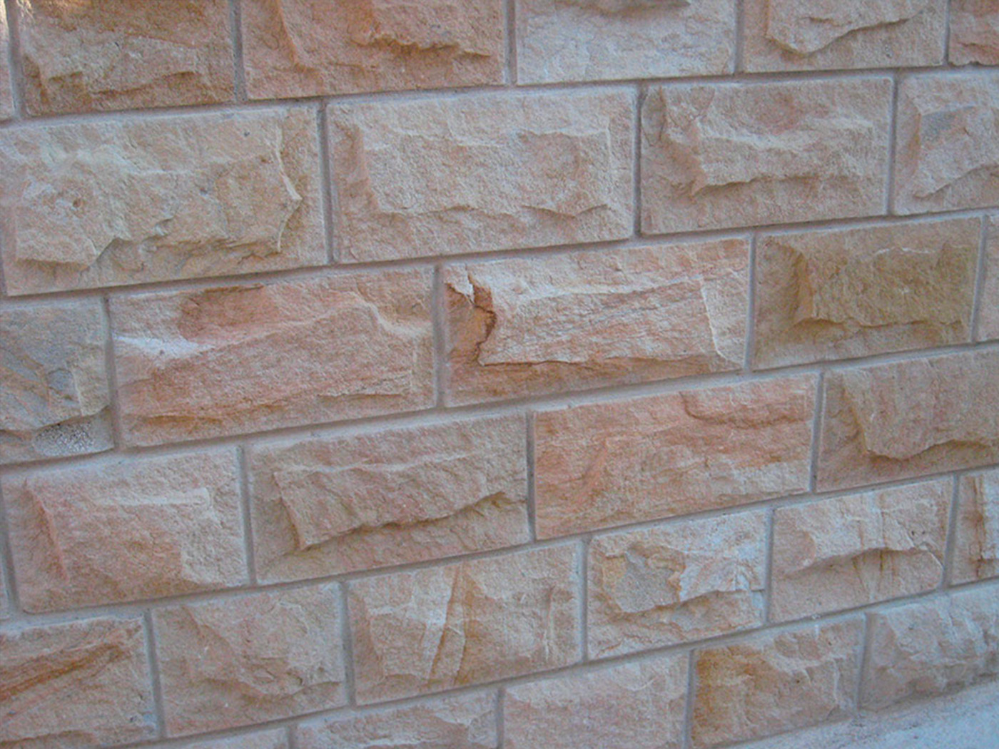 Pitched face walling
